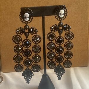 Women portrait with dangle stones ( one stone missing)